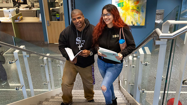 two students on stairs