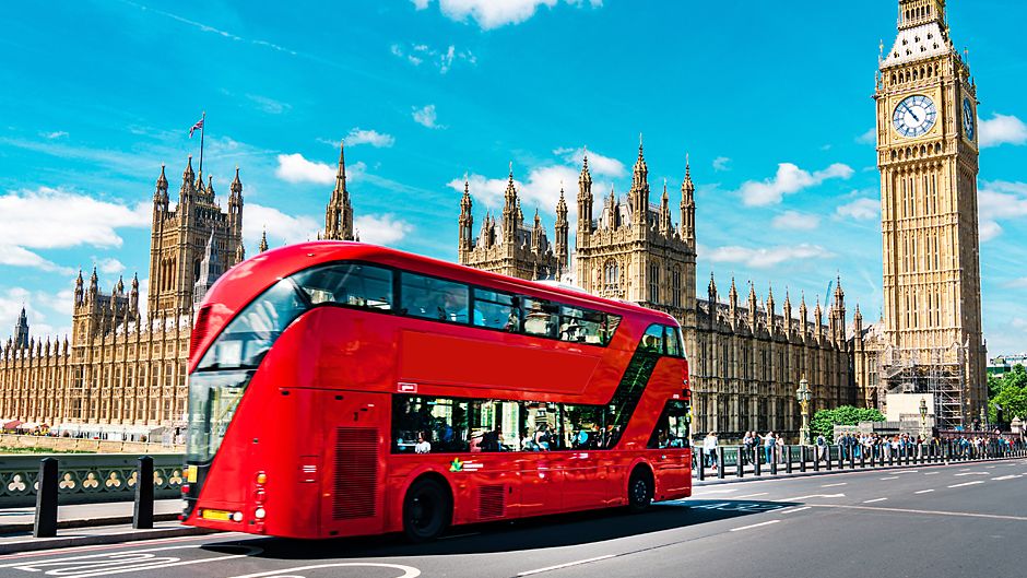 London, England a colorful bus by Big Ben